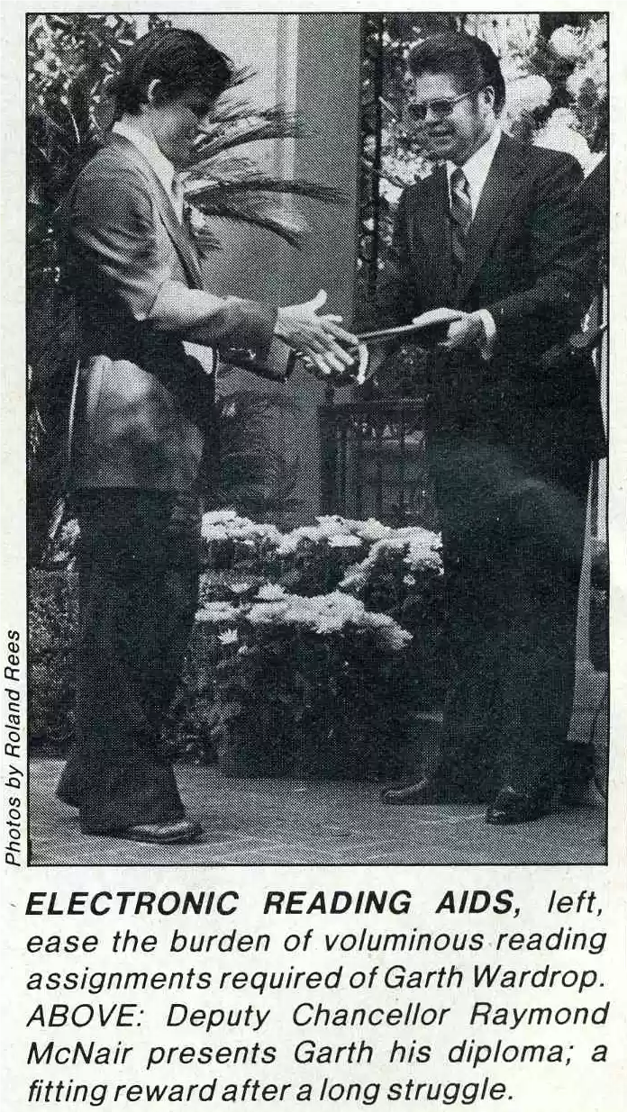 Garth receving his diploma from Raymond McNair